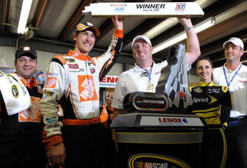 LOUDON, NH - JUNE 28:  Joey Logano, driver of the #20 Home Depot Toyota, celebrates winning the NASCAR Sprint Cup Series LENOX Industrial Tools 301 at New Hampshire Motor Speedway on June 28, 2009 in Loudon, New Hampshire. Logano won the rain shortened race with 27 laps remaining.  (Photo by Drew Hallowell/Getty Images for NASCAR)