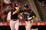 ANAHEIM, CA - JUNE 23:  Troy Tulowitzki #2 and Brad Hawpe #11 of the Colorado Rockies celebrate as they both score on Tulowitzki's two-run home run in the sixth inning against the Los Angeles Angels of Anaheim at Angel Stadium June 23, 2009 in Anaheim, California.   (Photo by Stephen Dunn/Getty Images)