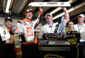 LOUDON, NH - JUNE 28:  Joey Logano, driver of the #20 Home Depot Toyota, celebrates winning the NASCAR Sprint Cup Series LENOX Industrial Tools 301 at New Hampshire Motor Speedway on June 28, 2009 in Loudon, New Hampshire. Logano won the rain shortened race with 27 laps remaining.  (Photo by Drew Hallowell/Getty Images for NASCAR)