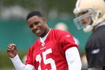 SANTA CLARA, CA - MAY 01:  Michael Crabtree #15 of the San Francisco 49ers looks on during practice as quaterback Alex Smith #11 practices during the 49ers Minicamp at their training facilities on May 1, 2009 in Santa Clara, California. Crabtree was the 49ers first round draft pick.  (Photo by Jed Jacobsohn/Getty Images)