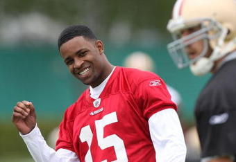 SANTA CLARA, CA - MAY 01:  Michael Crabtree #15 of the San Francisco 49ers looks on during practice as quaterback Alex Smith #11 practices during the 49ers Minicamp at their training facilities on May 1, 2009 in Santa Clara, California. Crabtree was the 49ers first round draft pick.  (Photo by Jed Jacobsohn/Getty Images)
