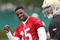SANTA CLARA, CA - MAY 01:  Michael Crabtree #15 of the San Francisco 49ers looks on during practice as quaterback Alex Smith #11 practices during the 49ers Minicamp at their training facilities on May 1, 2009 in Santa Clara, California. Crabtree was the 49ers first round draft pick.  (Photo by Jed Jacobsohn/Getty Images)