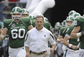 ORLANDO, FL - JANUARY 1: Coach Mark Dantonio of the Michigan State Spartans leads the team to the field for play against the Georgia Bulldogs at the 2009 Capital One Bowl at the Citrus Bowl on January 1, 2009 in Orlando, Florida.  (Photo by Al Messerschmidt/Getty Images) 