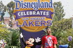 ANAHEIM, CA - JUNE 18:  In this handout provided by Disney, Lakers star and NBA Finals MVP Kobe Bryant waves to thousands of fans during a parade celebrating the 2009 World Champion Los Angeles Lakers at Disneyland on June 18, 2009 in Anaheim, California.  (Photo by Scott Brinegar/Disney via Getty Images)