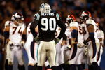CHARLOTTE, NC - DECEMBER 14:  Julius Peppers #90 of the Carolina Panthers waits for the Denver Broncos offense during their game at Bank of America Stadium on December 14, 2008 in Charlotte, North Carolina  (Photo by Streeter Lecka/Getty Images)