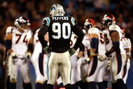 CHARLOTTE, NC - DECEMBER 14:  Julius Peppers #90 of the Carolina Panthers waits for the Denver Broncos offense during their game at Bank of America Stadium on December 14, 2008 in Charlotte, North Carolina  (Photo by Streeter Lecka/Getty Images)