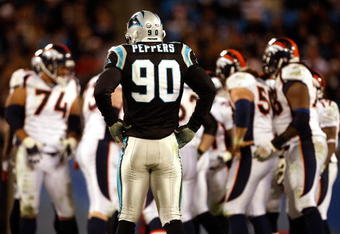 CHARLOTTE, NC - DECEMBER 14:  Julius Peppers #90 of the Carolina Panthers waits for the Denver Broncos offense during their game at Bank of America Stadium on December 14, 2008 in Charlotte, North Carolina  (Photo by Streeter Lecka/Getty Images)