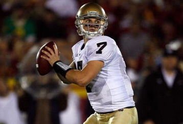 LOS ANGELES, CA - NOVEMBER 29:  Jimmy Clausen #7 of the Notre Dame Fighting Irish passes against the USC Trojans during the game at the Coliseum on November 29, 2008 in Los Angeles, California.  (Photo by Harry How/Getty Images)