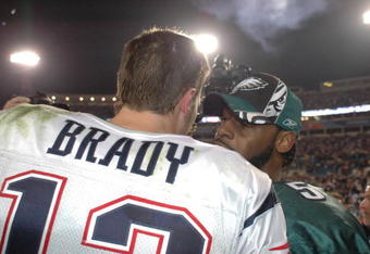 New England Patriots QB Tom Brady #12  talks with Eagles QB # 5 Donovan McNabb after the Patriots defeated the Eagles in Super Bowl XXXIX between the Philadelphia Eagles and the New England Patriots at Alltel Stadium in Jacksonville, Florida on February 6, 2005.  (Photo by Al Messerschmidt/Getty Images)