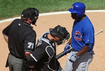 CHICAGO - JUNE 28:  Milton Brandley #21 of the Chicago Cubs asks for the count from home plate umpire Brain Runge #71 as A.J. Pierzynski #12 of the Chicago White Sox listens on June 28, 2009 at U.S. Cellular Field in Chicago, Illinois. The White Sox defeated the Cubs 6-0. (Photo by Jonathan Daniel/Getty Images)