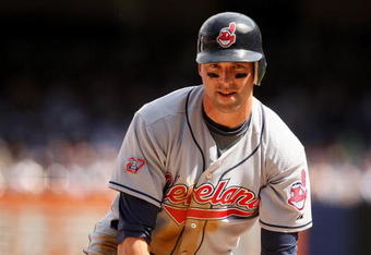 NEW YORK - APRIL 17:  Mark DeRosa #7 of the Cleveland Indians stands up after sliding safely in to third base during their game against the New York Yankees at Yankee Stadium on April 17, 2009 in the Bronx borough of New York City.  (Photo by Ezra Shaw/Getty Images)