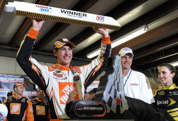 LOUDON, NH - JUNE 28:  Joey Logano, driver of the #20 Home Depot Toyota, celebrates winning the NASCAR Sprint Cup Series LENOX Industrial Tools 301 at New Hampshire Motor Speedway on June 28, 2009 in Loudon, New Hampshire. Logano won the rain shortened race with 27 laps remaining.  (Photo by Drew Hallowell/Getty Images for NASCAR)