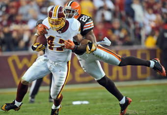 LANDOVER, MD - OCTOBER 19: Tight end Chris Cooley #47 of the Washington Redskins gets tackled by free safety Sean Jones #26 of the Cleveland Browns on October 19, 2008 at FedEx Field in Landover, Maryland. (Photo by Drew Hallowell/Getty Images)