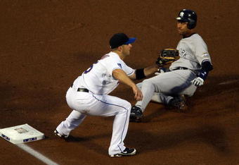 NEW YORK - JUNE 28: David Wright #5 of the New York Mets is late with the tag as Derek Jeter #2 of the New York Yankees slides safely into third base in the first inning on June 28, 2009 at Citi Field in the Flushing neighborhood of the Queens borough of New York City. (Photo by Jim McIsaac/Getty Images)