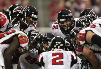 GLENDALE, AZ - JANUARY 03:   The Atlanta Falcons huddle around quarterback Matt Ryan #2 in the NFC Wild Card Game against the Arizona Cardinals on January 3, 2009 at University of Phoenix Stadium in Glendale, Arizona. The Cardinals defeated the Falcons 30-24.  (Photo by Jed Jacobsohn/Getty Images)