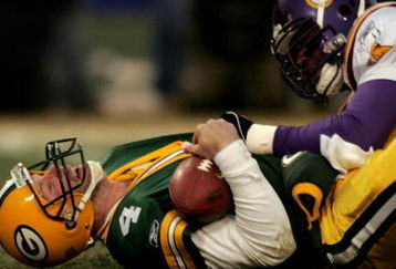 GREEN BAY, WI - JANUARY 9:  Linebacker Chris Claiborne #55 of the Minnesota Vikings sacks quarterback Brett Favre #4 of the Green Bay Packers in the NFC wild-card game at Lambeau Field on January 9, 2005 in Green Bay, Wisconsin. (Photo by Doug Benc/Getty Images)