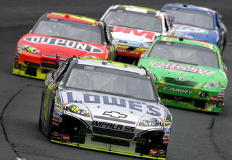 LOUDON, NH - JUNE 28:  Jimmie Johnson, driver of the #48 Lowe's/KOBALT Tools Chevrolet, leads a group of cars during the NASCAR Sprint Cup Series LENOX Industrial Tools 301 at New Hampshire Motor Speedway on June 28, 2009 in Loudon, New Hampshire.  (Photo by Chris Trotman/Getty Images)
