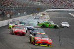 LOUDON, NH - JUNE 28:  Jeff Gordon, driver of the #24 DuPont Chevrolet, leads the field as Martin Truex Jr., driver of the #1 TomTom Chevrolet, loses control and hits wall during the NASCAR Sprint Cup Series LENOX Industrial Tools 301 at New Hampshire Motor Speedway on June 28, 2009 in Loudon, New Hampshire.  (Photo by Chris Graythen/Getty Images)