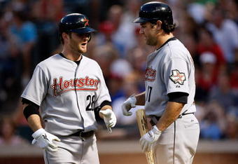 ARLINGTON, TX - JUNE 18:  Jeff Keppinger #28 and Lacnce Berkman #17 of the Houston Astros celebrate a run against the Texas Rangers in the 6th inning on June 18, 2009 at Rangers Ballpark in Arlington, Texas.  (Photo by Ronald Martinez/Getty Images)