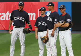 BRONX, NY - JULY 14:  (L-R) Derek Jeter of the New York Yankees, Dustin Pedroia, Terry Francona and an unidentified member of the Boston Red Sox speak in the outfield during batting practice for the 2008 MLB All-Star game at Yankee Stadium on July 14, 2008 in the Bronx, New York. (Photo by Jim McIsaac/Getty Images)