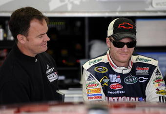 LONG POND, PA - JUNE 06: Dale Earnhardt Jr. driver of the #88 National Guard/AMP Energy Chevrolet talks with Crew Chief Lance McGrew before practice for the NASCAR Sprint Cup Series Pocono 500 on June 6, 2009 at Pocono International Raceway in Long Pond, Pennsylvania.  (Photo by John Harrelson/Getty Images for NASCAR)
