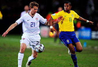 JOHANNESBURG, SOUTH AFRICA - JUNE 28:  Robinho of Brazil battles with Jonathan Spector of the USA during the FIFA Confederations Cup Final match between USA and Brazil at Ellis Park Stadium on June 28, 2009 in Johannesburg, South Africa.  (Photo by Jamie McDonald/Getty Images)