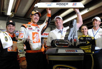 LOUDON, NH - JUNE 28:  Joey Logano, driver of the #20 Home Depot Toyota, celebrates winning the NASCAR Sprint Cup Series LENOX Industrial Tools 301 at New Hampshire Motor Speedway on June 28, 2009 in Loudon, New Hampshire. Logano won the rain shortened race with 27 laps remaining.  (Photo by Drew Hallowell/Getty Images for NASCAR)