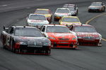 LOUDON, NH - JUNE 28:  David Stremme, driver of the #12 Penske Dodge, races Joey Logano, driver of the #20 Home Depot Toyota, and Reed Sorenson, driver of the #43 McDonald's McCafe Dodge, during the NASCAR Sprint Cup Series LENOX Industrial Tools 301 at New Hampshire Motor Speedway on June 28, 2009 in Loudon, New Hampshire.  (Photo by Chris Trotman/Getty Images)