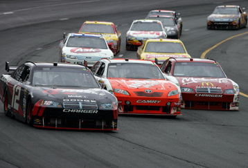 LOUDON, NH - JUNE 28:  David Stremme, driver of the #12 Penske Dodge, races Joey Logano, driver of the #20 Home Depot Toyota, and Reed Sorenson, driver of the #43 McDonald's McCafe Dodge, during the NASCAR Sprint Cup Series LENOX Industrial Tools 301 at New Hampshire Motor Speedway on June 28, 2009 in Loudon, New Hampshire.  (Photo by Chris Trotman/Getty Images)