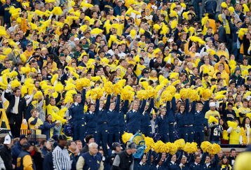 ANN ARBOR, MI - OCTOBER 25:  Fans of the Michigan Wolverines cheer from the stands during the game against the Michigan State Spartans on October 25, 2008 at Michigan Stadium in Ann Arbor, Michigan. Michigan State won the game 35-21. (Photo by Gregory Shamus/Getty Images)