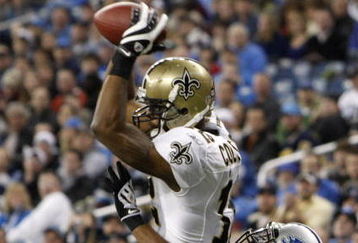 DETROIT - DECEMBER 21:  Wide receiver Marques Colston #12 of the New Orleans Saints scores on a six yard pass in the third quarter as Detroit Lions cornerback Ramzee Robinson #38 attempts to defend on December 21, 2008 at Ford Field in Detroit, Michigan. The New Orleans Saints defeated the Detroit Lions 42-7.  (Photo by Leon Halip/Getty Images)
