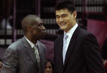 HOUSTON - MAY 10:  Center Dikembe Mutombo and Yao Ming of the Houston Rockets during Game Four of the Western Conference Semifinals during the 2009 NBA Playoffs at Toyota Center on May 10, 2009 in Houston, Texas. NOTE TO USER: User expressly acknowledges and agrees that, by downloading and or using this photograph, User is consenting to the terms and conditions of the Getty Images License Agreement.  (Photo by Ronald Martinez/Getty Images)