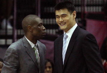 HOUSTON - MAY 10:  Center Dikembe Mutombo and Yao Ming of the Houston Rockets during Game Four of the Western Conference Semifinals during the 2009 NBA Playoffs at Toyota Center on May 10, 2009 in Houston, Texas. NOTE TO USER: User expressly acknowledges and agrees that, by downloading and or using this photograph, User is consenting to the terms and conditions of the Getty Images License Agreement.  (Photo by Ronald Martinez/Getty Images)