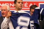 MONTREAL, QC - JUNE 26:  Nazem Kadri puts on his new Toronto Maple Leafs sweater after he was selected #7 overall by the Leafs during the first round of the 2009 NHL Entry Draft at the Bell Centre on June 26, 2009 in Montreal, Quebec, Canada.  (Photo by Bruce Bennett/Getty Images)