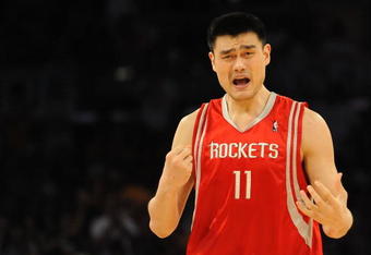 LOS ANGELES, CA - MAY 06:  Yao Ming #11 of the Houston Rockets reacts to a foul called on him in the second quarter against the Los Angeles Lakers in Game Two of the Western Conference Semifinals during the 2009 NBA Playoffs at Staples Center on May 6, 2009 in Los Angeles, California. NOTE TO USER: User expressly acknowledges and agrees that, by downloading and or using this photograph, User is consenting to the terms and conditions of the Getty Images License Agreement.  (Photo by Harry How/Getty Images)
