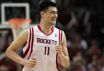 HOUSTON - APRIL 30:  Center Yao Ming #11 of the Houston Rockets reacts during play against the Portland Trail Blazers in Game Six of the Western Conference Quarterfinals during the 2009 NBA Playoffs at Toyota Center on April 30, 2009 in Houston, Texas. NOTE TO USER: User expressly acknowledges and agrees that, by downloading and or using this photograph, User is consenting to the terms and conditions of the Getty Images License Agreement.  (Photo by Ronald Martinez/Getty Images)