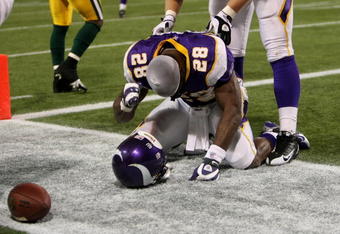 MINNEAPOLIS - NOVEMBER 09:  Running back Adrian Peterson #28 of the Minnesota Vikings celebrates his game winning 29 yard touchdown run with 2:22 left in the game with the Green Bay Packers on November 9, 2008 at the Metrodome in Mineapolis, Minnesota.  (Photo by Stephen Dunn/Getty Images)
