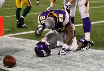 MINNEAPOLIS - NOVEMBER 09:  Running back Adrian Peterson #28 of the Minnesota Vikings celebrates his game winning 29 yard touchdown run with 2:22 left in the game with the Green Bay Packers on November 9, 2008 at the Metrodome in Mineapolis, Minnesota.  (Photo by Stephen Dunn/Getty Images)