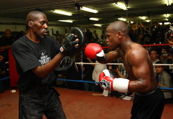 LONDON, ENGLAND - MAY 22:  Boxing superstar Floyd Mayweather in his first open workout since coming out of retirement with trainer and uncle Roger Mayweather, as he prepares for his fight against Juan Manuel Marquez of Mexico, at Peacock Gym on May 22, 2009 in London, England.  The fight's due to take place on July 18, 2009 at the MGM Grand in Las Vegas, Nevada. (Photo by Julian Finney/Getty Images)