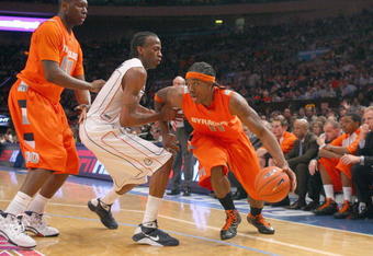 NEW YORK - MARCH 12:  Paul Harris #11 of the Syracuse Orange drives the ball against the Connecticut Huskies during the quarterfinals of the Big East Tournament at Madison Square Garden on March 12, 2009 in New York City. (Photo by: Jim McIsaac/Getty Images)