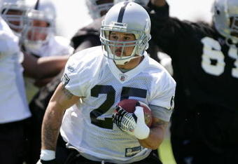 ALAMEDA, CA - MAY 08:  Justin Fargas #25 of the Oakland Raiders runs with the ball during the Raiders minicamp at the team's permanent training facility on May 8, 2009 in Alameda, California.  (Photo by Ezra Shaw/Getty Images)