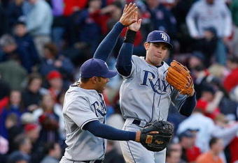 BOSTON - APRIL 9: Evan Longoria #3 and Carlos Pena #23 of the Tampa Bay Rays celebrate their win, 4-3, over the Boston Red Sox at Fenway Park April 9, 2009, in Boston, Massachusetts. (Photo by Jim Rogash/Getty Images)