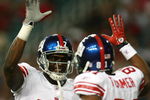 ATLANTA - OCTOBER 15:  Wide receivers Amani Toomer #81 and Plaxico Burress #17 of the New York Giants celebrate Toomer's touchdown catch in the first quarter against the Atlanta Falcons at Georgia Dome on October 15, 2007 in Atlanta, Georgia. The Giants defeated the Falcons 31-10 for their fourth straight win after opening the season 0-2.  (Photo by Doug Benc/Getty Images)