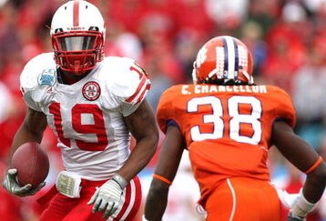 JACKSONVILLE, FL - JANUARY 1:  Quentin Castille #19 of the Nebraska Cornhuskers attempts to allude the tackle of Chris Chancellor #38 of the Clemson Tigers during the Konica Minolta Gator Bowl at Jacksonville Municipal Stadium January 1, 2009 in Jacksonville, Florida.  (Photo by Sam Greenwood/Getty Images)