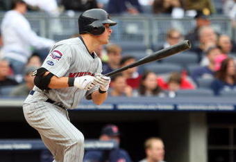 NEW YORK - MAY 17:  Matt Tolbert #20 of the Minnesota Twins hits a RBI single in the seventh inning against the New York Yankees on May 17, 2009 at Yankee Stadium in the Bronx borough of New York City.  (Photo by Jim McIsaac/Getty Images)