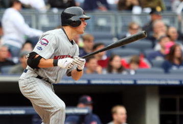 NEW YORK - MAY 17:  Matt Tolbert #20 of the Minnesota Twins hits a RBI single in the seventh inning against the New York Yankees on May 17, 2009 at Yankee Stadium in the Bronx borough of New York City.  (Photo by Jim McIsaac/Getty Images)
