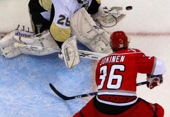 RALEIGH, NC - MAY 26:  Goaltender Marc-Andre Fleury #29 of the Pittsburgh Penguins saves a shot on goal by Jussi Jokinen #36 of the Carolina Hurricanes during Game Four of the Eastern Conference Championship Round of the 2009 Stanley Cup Playoffs at RBC Center on May 26, 2009 in Raleigh, North Carolina.  (Photo by Jim McIsaac/Getty Images)