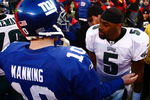 EAST RUTHERFORD, NJ - JANUARY 11:  Eli Manning #10 of the New York Giants greets Donovan McNabb #5 of the Philadelphia Eagles after the NFC Divisional Playoff Game on January 11, 2009 at Giants Stadium in East Rutherford, New Jersey.The Eagles won the game by a score of 23-11.  (Photo by Chris McGrath/Getty Images)