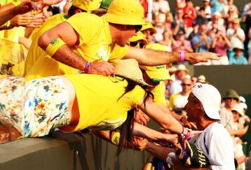 WIMBLEDON, ENGLAND - JUNE 29:  Lleyton Hewitt of Australia is congratulated by fans after victory during the men's singles fourth round match against Radek Stepanek of Czech Republic on Day Seven of the Wimbledon Lawn Tennis Championships at the All England Lawn Tennis and Croquet Club on June 29, 2009 in London, England.  (Photo by Ian Walton/Getty Images)