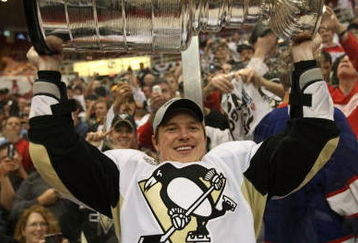 DETROIT - JUNE 12: Ruslan Fedotenko #26 of the Pittsburgh Penguins celebrates with the Stanley Cup following the Penguins victory over the Detroit Red Wings in Game Seven of the 2009 NHL Stanley Cup Finals at Joe Louis Arena on June 12, 2009 in Detroit, Michigan. (Photo by Bruce Bennett/Getty Images)